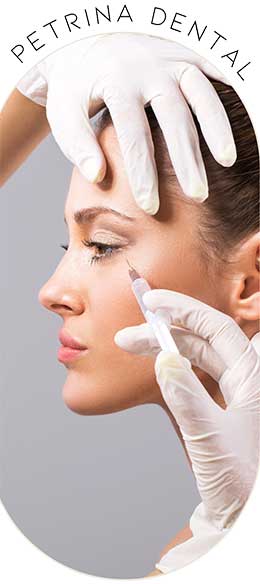 Gloved hands holding a womans face and injecting anti-wrinkle serum